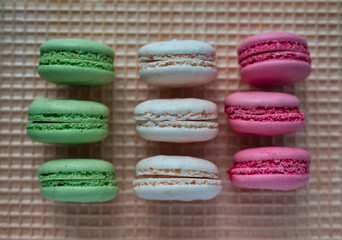Colored macarons on waffle background