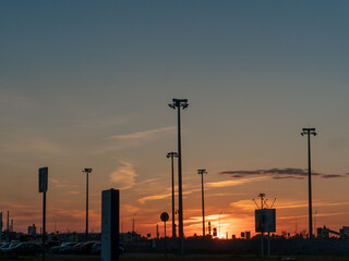 Fototapeta na wymiar sunset in the parking lot near the store