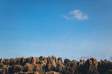Moon over the mountains at daytime. Cerro del Hierro. 