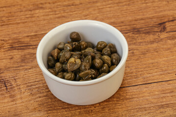 Tasty capers in the bowl