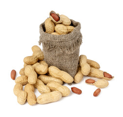 dried peanuts in a hemp bag on a white background close up