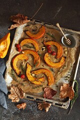 Oven roasted  pumpkin with cherry tomatoes and feta cheese. Overhead view