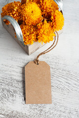 Orange chrysanthemum flowers in wooden box