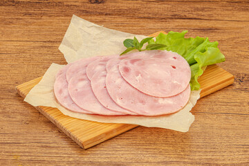 Slised ham snack over board
