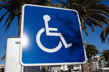 Sign for disabled parking close-up. A clear sunny day.