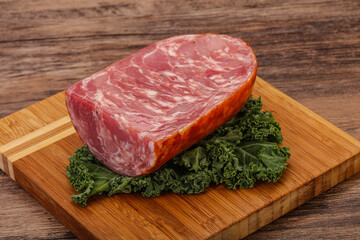 Beef ham piece over board