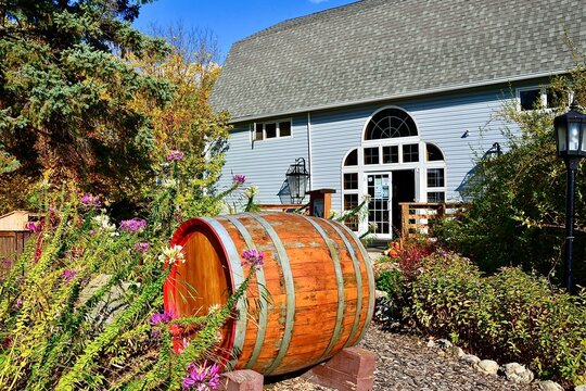 Wooden wine barrel displayed in front of the winery as beautiful decoration and symbols of wine making. Finger Lakes Wine Country