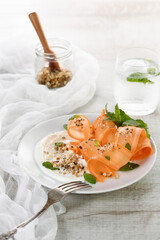 Gluten free vegetarian salad with carrot and yogurt seasoned with crushed nuts and spices, mint castings