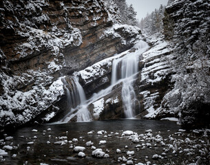 Cameron Falls during the winter in Waterton Park after a snowfall.