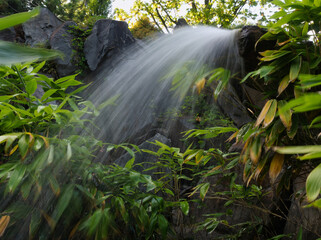 Small waterfall in erfurt at egapark into summer