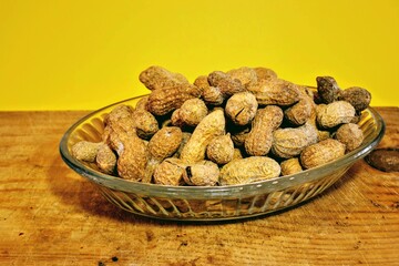 Groups of salted and baked peanuts. Unshelled and shelled peanuts and baked with salt. Isolated background.