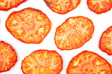 slices of dried tomato on a white background. vitamin vegetable food