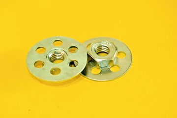 Obraz premium Bonding fastener for composite products. Metric 8 hexagonal nut and base plate with holes in base plate.