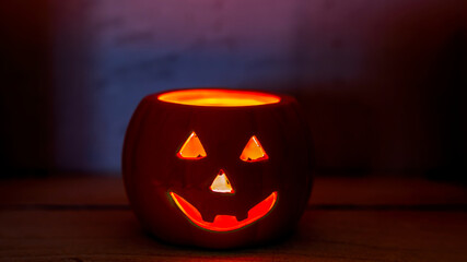 Halloween fall pumpkin candle glowing face