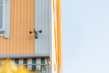 An anemometer on a wall.