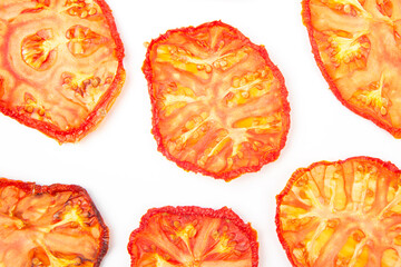 slices of dried tomato on a white background. vitamin vegetable food