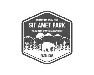 National park vintage badge. Mountain explorer label. Outdoor adventure logo design with bear. Travel and hipster insignia. Wilderness, forest camping emblem Hiking, backpack monochrome.