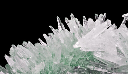 green and white small long crystals on black