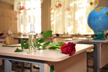antiseptic and rose on the school Desk,antiseptic on the school Desk,