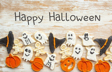 Halloween Jack o Lantern cookies, pumpkin, ghost, black cat, witch hat. Trick or Treat background