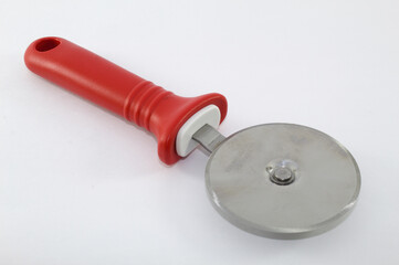 Circular pizza cutter with red handle and white background