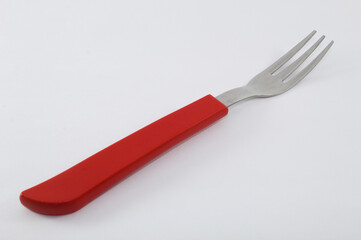 Fork with red handle and white background