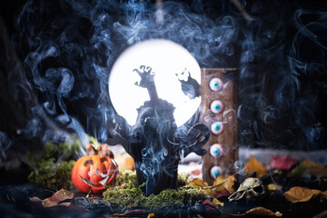 Halloween decoration on dark spooky forest with full moon