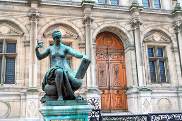 Fototapeta na wymiar Bronze statue of nude woman at City Hall in Paris . Muse of art and literature sculpture 