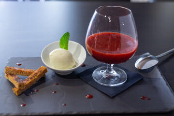 Red fruit coulis with ice in a restaurant