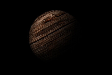 wooden sphere isolated on black