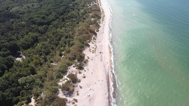 Beautiful aerial drone wide view of Curonian spit, Kurshskaya Kosa National Park, Curonian Lagoon and the Baltic Sea, Kaliningrad Oblast, Russia and Klaipeda County, Lithuania, summer day
