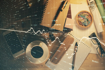 Double exposure of forex graph drawing and work table top veiw. Concept of financial analysis.