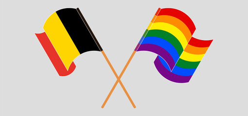 Crossed and waving flags of Belgium and LGBTQ