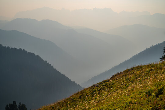 Hazy layers of wildfire smoke in the north cascade mountains