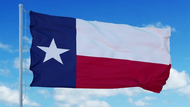 Texas flag on a flagpole waving in the wind, blue sky background. 4K