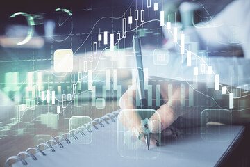 Double exposure of forex chart drawing over people taking notes background. Concept of financial analysis