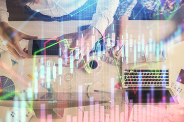 Double exposure of man and woman working together and financial chart hologram drawing. market analysis concept. Computer background. Top View.