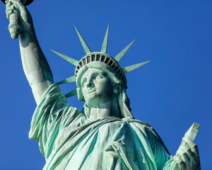 USA, New York, New York City, Statue of Liberty against blue sky