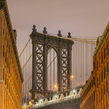 USA, New York, New York City, Manhattan Bridge illuminated at dusk