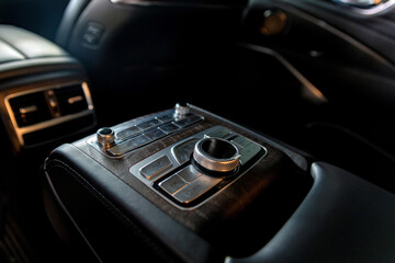 Fototapeta na wymiar Modern luxury car central console for rear passengers