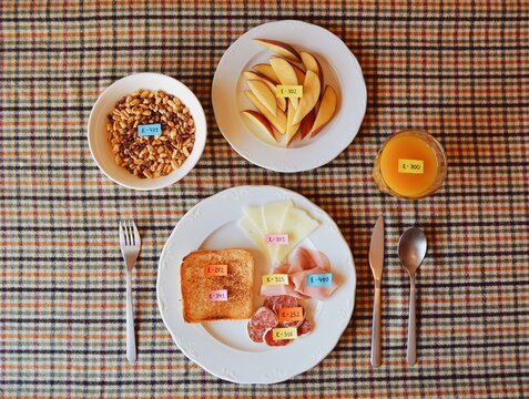 Food in a table. Additives in a common breakfast. Representation of food labeling with conservants