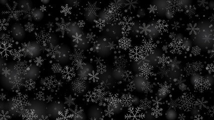 Christmas background of snowflakes of different shapes, sizes and transparency in gray and black colors