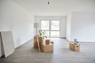 Empty room with many cardboard boxes