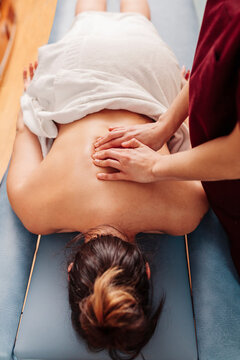Physiotherapist treating backache with massage