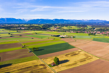 Germany, Bavaria, Huglfing, Drone view of countryside fields in Alpine foothills during spring
