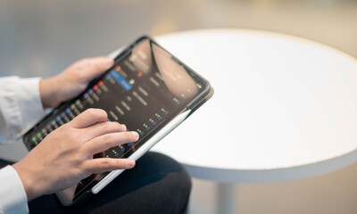 The female hand using the gadget device for find the free wifi in public area as a working at the co-working space