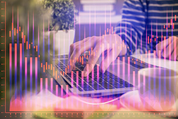 Double exposure of woman hands typing on computer and forex chart hologram drawing. Stock market invest concept.