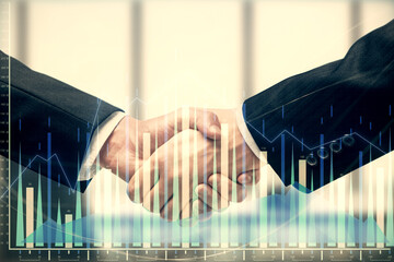 Double exposure of forex graph hologram and handshake of two men. Stock market concept.