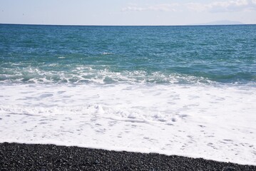 White waves on the autumn beach.
