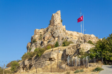 Mardin Castle and Turkish flag view. Old Mardin, Turkey